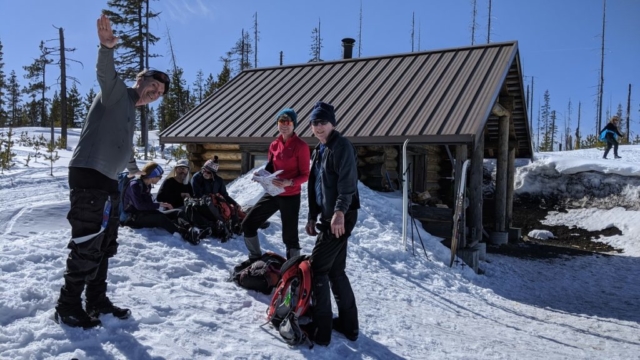 Warming hut at Ray Benson (Steve, Jan, Ron, Yvonne on hill)