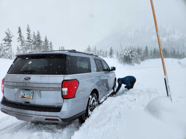 Car stuck in too-deep snow at Ray Benson Sno-Park, Santiam Pass, OR
